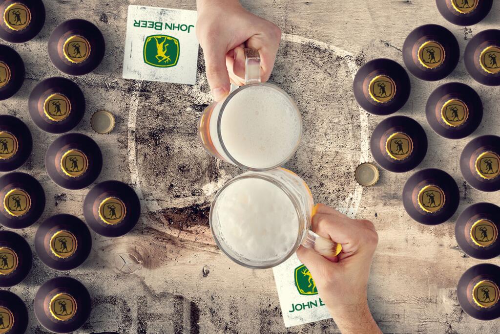 Men cheers with beer above a wooden table with JOHN BEER design by © 2021 funnydrinking.com