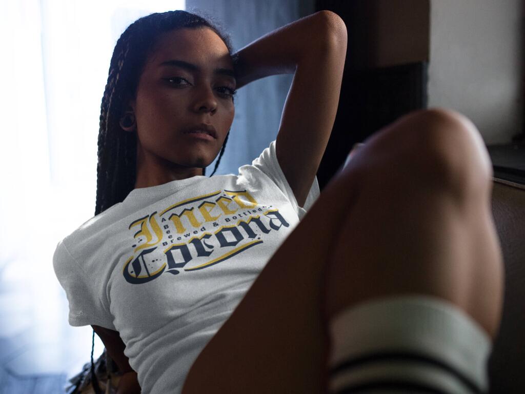 Young woman wearing a white t-shirt with I NEED CORONA design by © 2021 funnydrinking.com