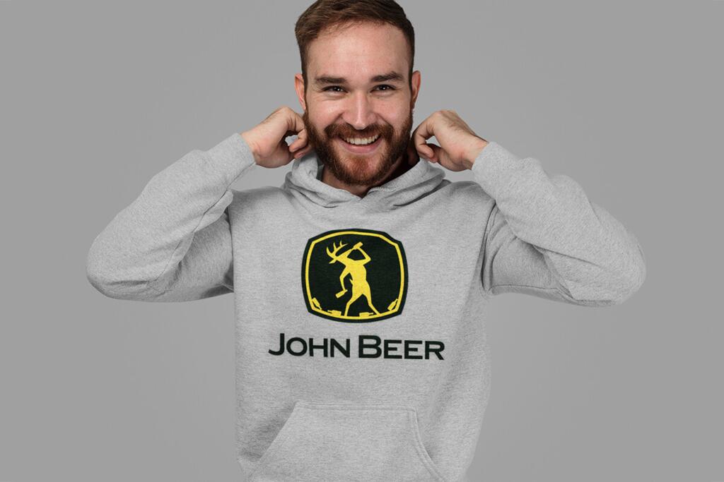 Young man wearing a grey hoodie with JOHN BEER design by © 2021 funnydrinking.com